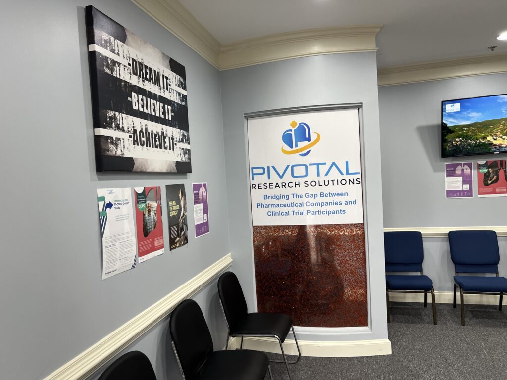 Pivotal Research Solutions lobby with branded wall sign